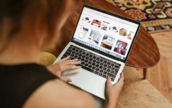 Person on laptop browsing an e-commerce site.